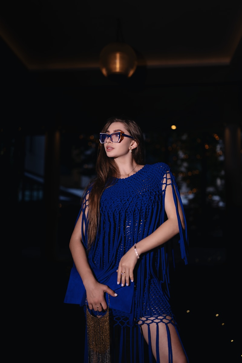 A woman in a blue dress posing for a picture