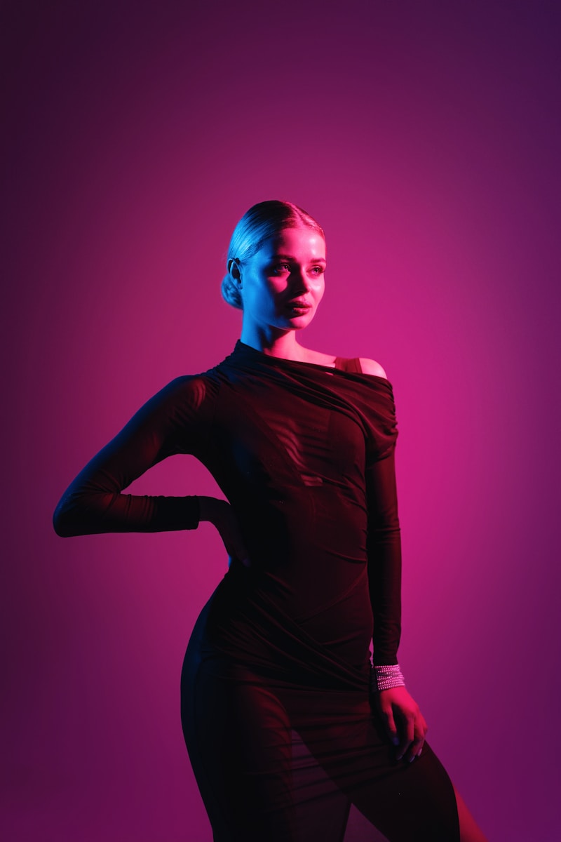 A woman in a black dress posing for a picture