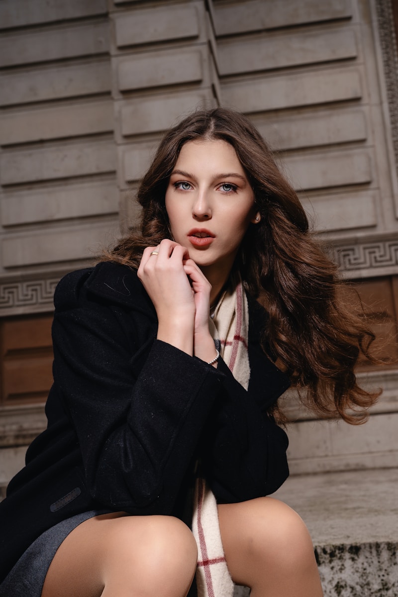 A woman sitting on the steps of a building