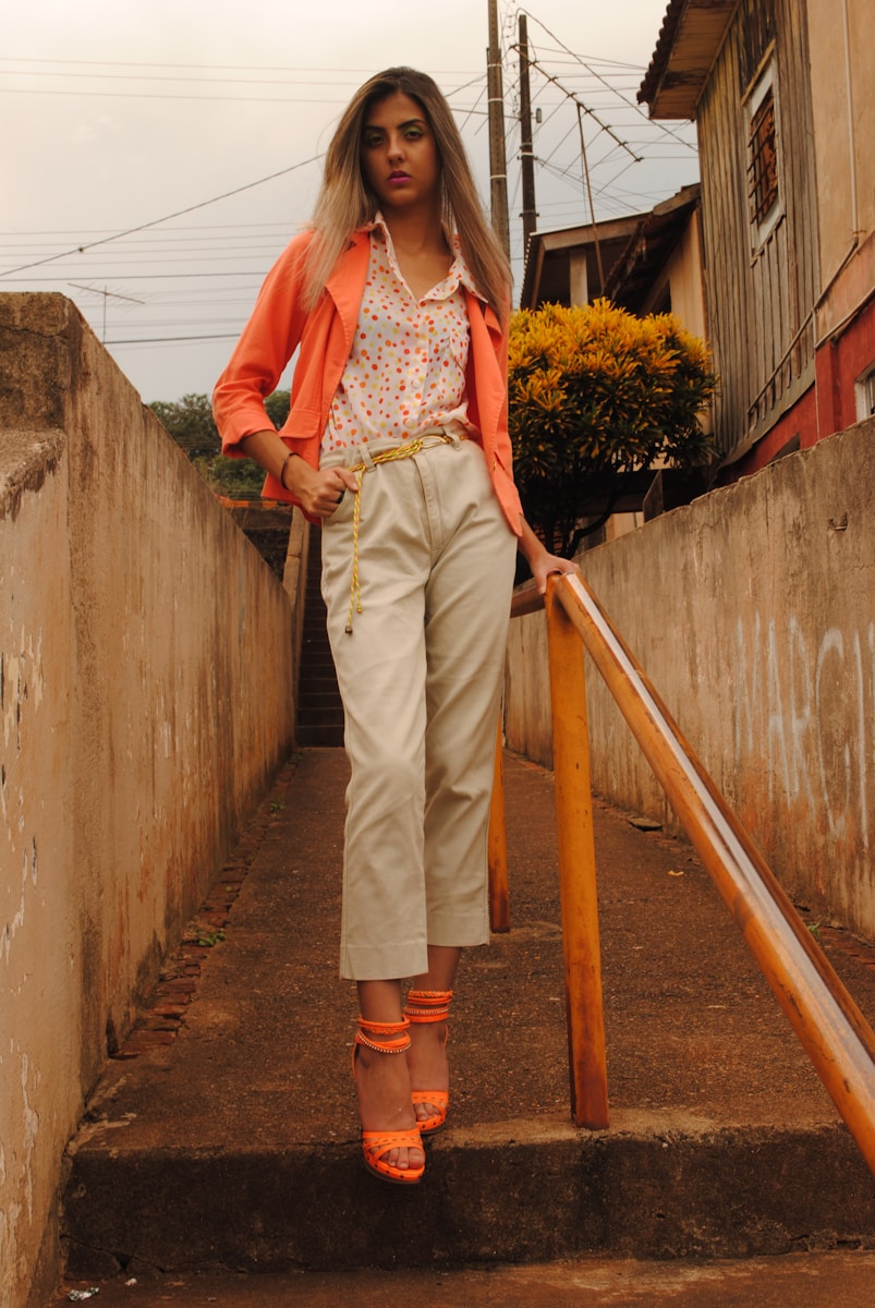 woman standing in the middle of a narrow pathway