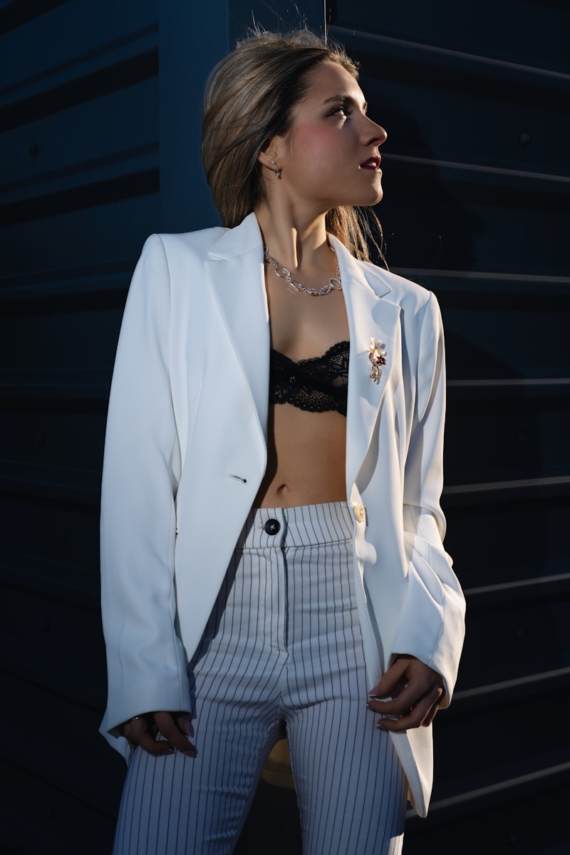 Woman in a blazer poses for the camera.